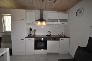 Kuchyň nebo kuchyňský kout v ubytování Ferienhaus Beerberg