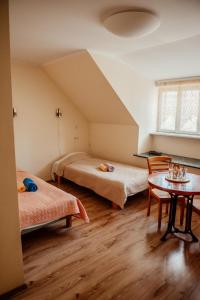 מיטה או מיטות בחדר ב-Edgari Guesthouse