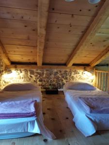 Postel nebo postele na pokoji v ubytování Festina Lente Heritage Villa Krk - Heated pool