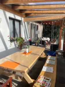 a wooden table sitting on a patio with a table at Apartmán Beruška in Křelovice