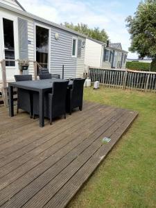 Zahrada ubytování Stacaravan met eigen terras en tuin 6personen + 6 fotografií