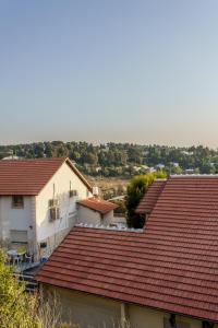 a group of houses with red roofs at הבית במעלות in Ma'alot Tarshiha