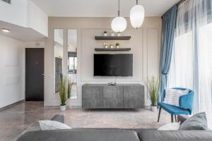 TV o dispositivi per l'intrattenimento presso Luxury 2BR with Nice View - Next King David Hotel