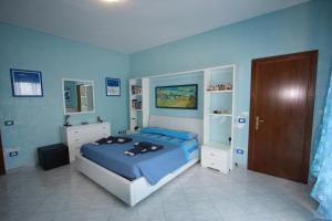 Postel nebo postele na pokoji v ubytování B&B Il Moai