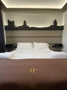 Postel nebo postele na pokoji v ubytování Palace Hotel Due Ponti