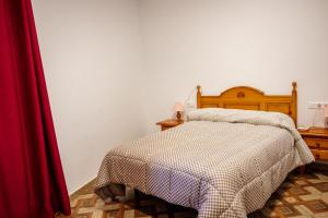 A bed or beds in a room at Rollo Campillo