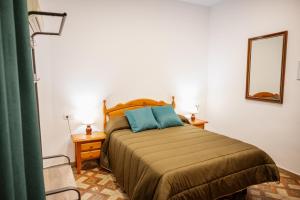 A bed or beds in a room at Rollo Campillo