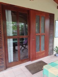 a sliding glass door with a view of a patio at MALLI'S VILLA in Koggala