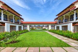 an exterior view of the courtyard of a building at Fairfield by Marriott Goa Benaulim in Benaulim