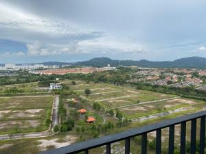arial view of a field with buildings and a city at Trefoil @ Studio Comfy~Dhomestay 2 in Shah Alam