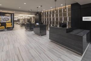 a lobby with a reception desk at Courtyard by Marriott Halifax Dartmouth in Halifax