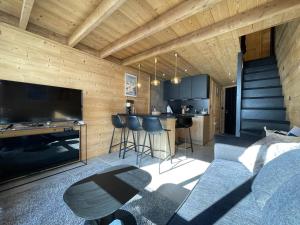 TV tai viihdekeskus majoituspaikassa Val Thorens - Cosy Duplex avec Vue Pied des pistes Silveralp 570