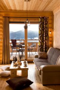 a living room with a couch and a table at Chalet Ana in Les Angles