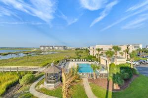 an aerial view of a resort with a swimming pool at Coastal Murrells Inlet Condo with Balcony! in Myrtle Beach