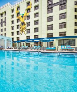 a large swimming pool in front of a hotel at Margaritaville Hotel San Diego Gaslamp Quarter in San Diego