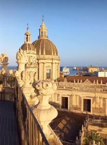 a building with a fountain in front of it at Sleep Inn Catania rooms - Affittacamere in Catania