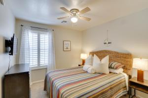 a bedroom with a bed and a ceiling fan at Maricopa Retreat with Peaceful Backyard Oasis! in Maricopa +35 photos