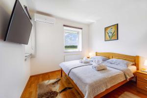 Postel nebo postele na pokoji v ubytování Villa Stipino