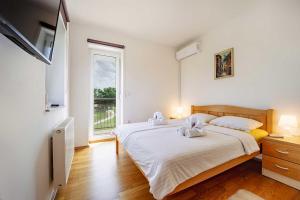 Postel nebo postele na pokoji v ubytování Villa Stipino
