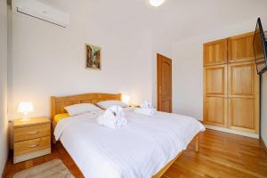 Postel nebo postele na pokoji v ubytování Villa Stipino