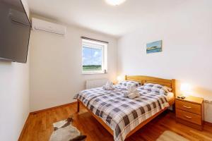 Postel nebo postele na pokoji v ubytování Villa Stipino