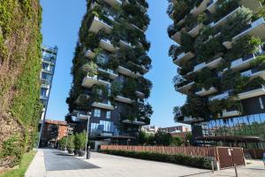 a tall building with plants on its sides at Luxury Suite in Bosco Verticale Milano Isola in Milan