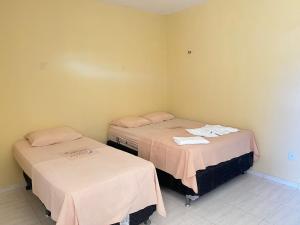 En eller flere senger på et rom på Residencial Negroni