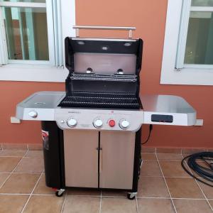 a grill sitting on top of a table at Boricua Realty VIP Luxury Ocean Front Penthouse 3 Bedrooms 3 Bathrooms 2 Levels in Fajardo