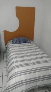 a bed in a corner of a room at Q'entiHospedaje San Blas 1 in Cusco