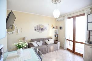 a living room with a couch and a table at Romantic Home in Pula
