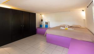 Letto o letti in una camera di Twakila Sunset Suites
