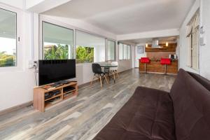 TV o dispositivi per l'intrattenimento presso Twakila Sunset Suites
