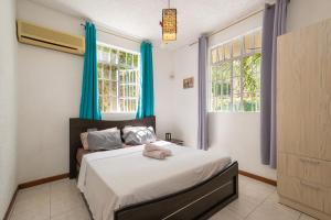 Letto o letti in una camera di Twakila Sunset Suites