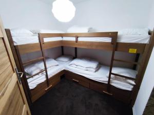 a group of bunk beds in a room at Superbe appartement à Isola 2000, 8 couchages, parking privé, à 5 min des pistes et commerces - FR-1-292-112 in Isola 2000