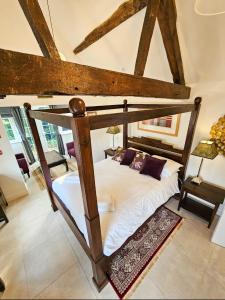 a bed in a room with a wooden bunk bed at Granary Villa in Kidderminster