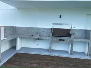 a bathroom with a sink and a mirror at Ocean Club - Ocean Suites II in Playas
