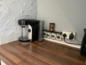 een koffiezetapparaat op een aanrecht bij Cosy and Comfortable Newly Refurbished Family Home in Hull