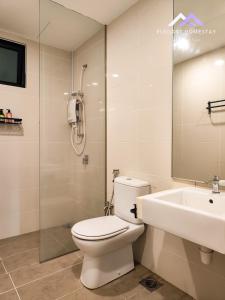 a bathroom with a toilet and a sink and a shower at Mosaic Southkey Midvelly By Elegant Johor Bahru in Johor Bahru