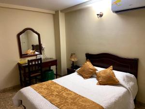 Postel nebo postele na pokoji v ubytování Hotel Khalifa