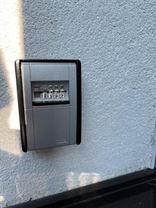 a soap dispenser on the side of a wall at Rodinný apartmán Za Školou in Rokytnice nad Jizerou