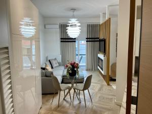 a living room with a table and a couch at Casa Divina in Veria