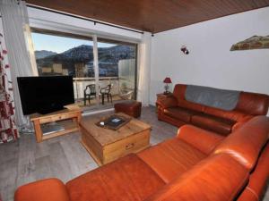 Appartement Huez, 3 pièces, 8 personnes - FR-1-405-102にあるシーティングエリア