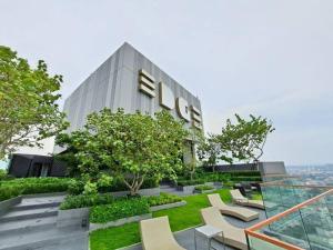 a building with a sign on the side of it at Downtown Chic Condo High Floor #ES54624 in Pattaya Central
