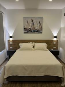 En eller flere senger på et rom på Kiran Lodging Guayaquil