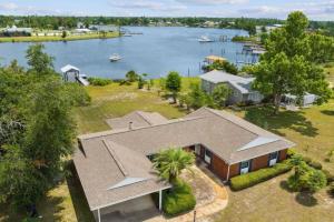 an aerial view of a house with a lake at Nautical Nirvana-Waterfront Joys from Sunrise Paddles to Hot Tub Sunsets in Panama City