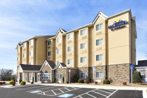 an image of ariott hotel in a parking lot at Microtel Inn & Suites by Wyndham in Shelbyville