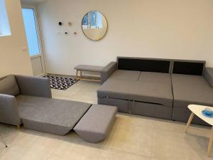 a living room with a couch and a table at Small Rica house in the center in Billund in Billund