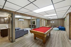a living room with a pool table in it at 5bedroom w Pergola Hottub & Firepit in Ephrata