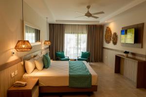 Postel nebo postele na pokoji v ubytování Bahia Principe Grand Punta Cana - All Inclusive + 37 fotografií
