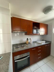 Köök või kööginurk majutusasutuses Departamento Antofagasta-Icono